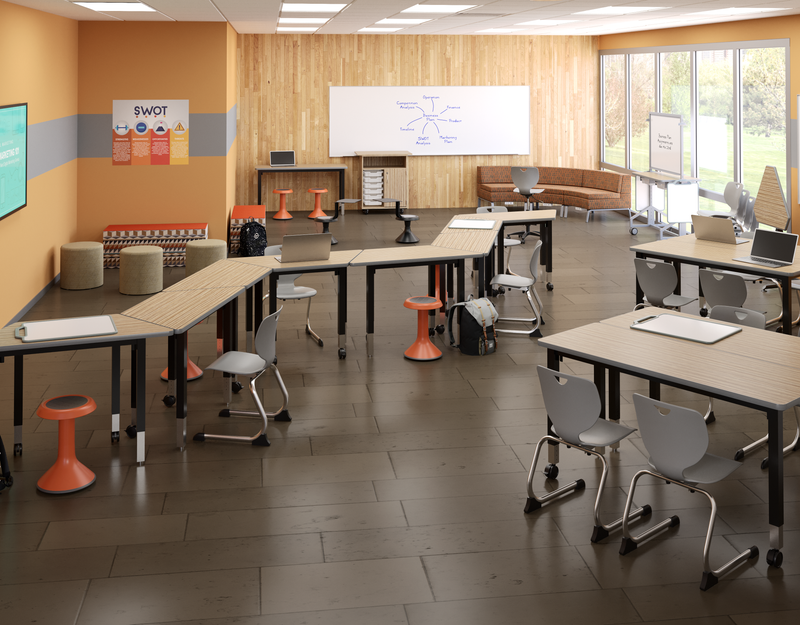 Grey and purple modern collaborative learning environment with pod seating, stools, and a tv.