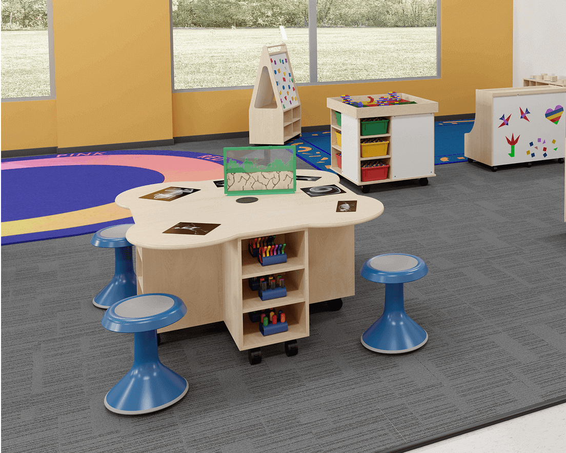 Collaborative classroom table with blue stools and built-in storage