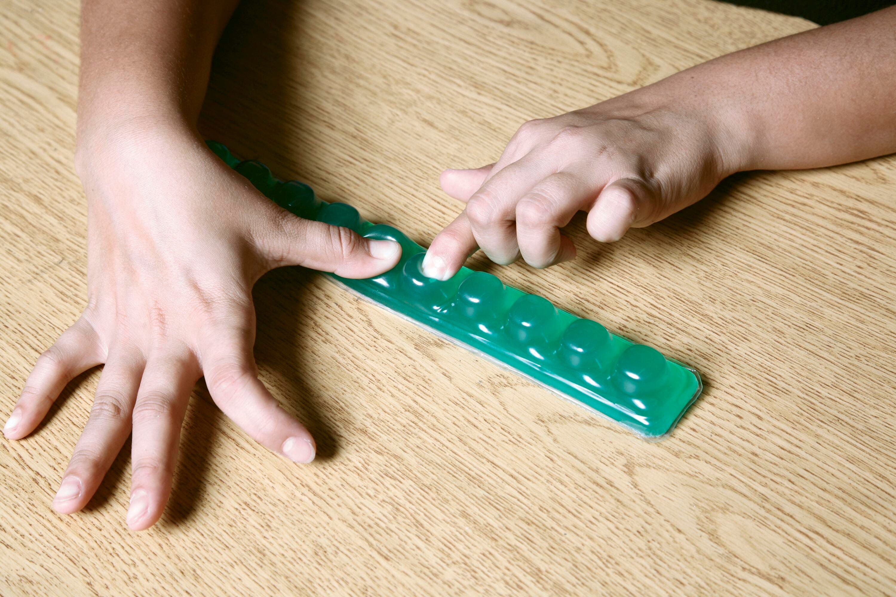 Abilitations Caterpinch Fidget, 9-7/8 x 1-1/2 x 1-3/16 Inches, Item Number 1322347