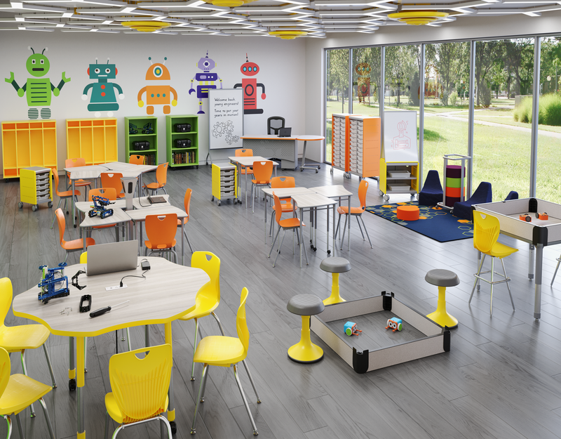 A blue and green modern learning environment with studen desks, a round table with charging station, stools, and several podiums.