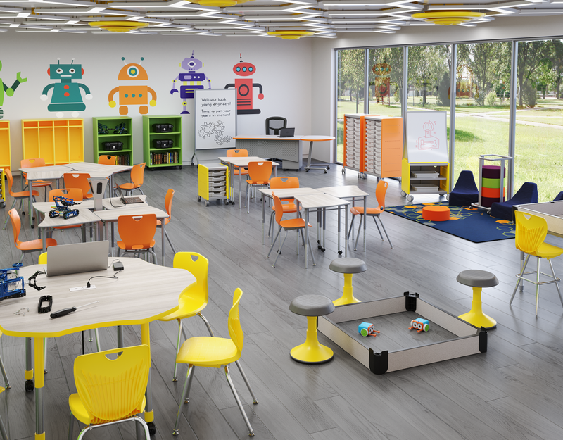 A blue and green modern learning environment with studen desks, a round table with charging station, stools, and several podiums.