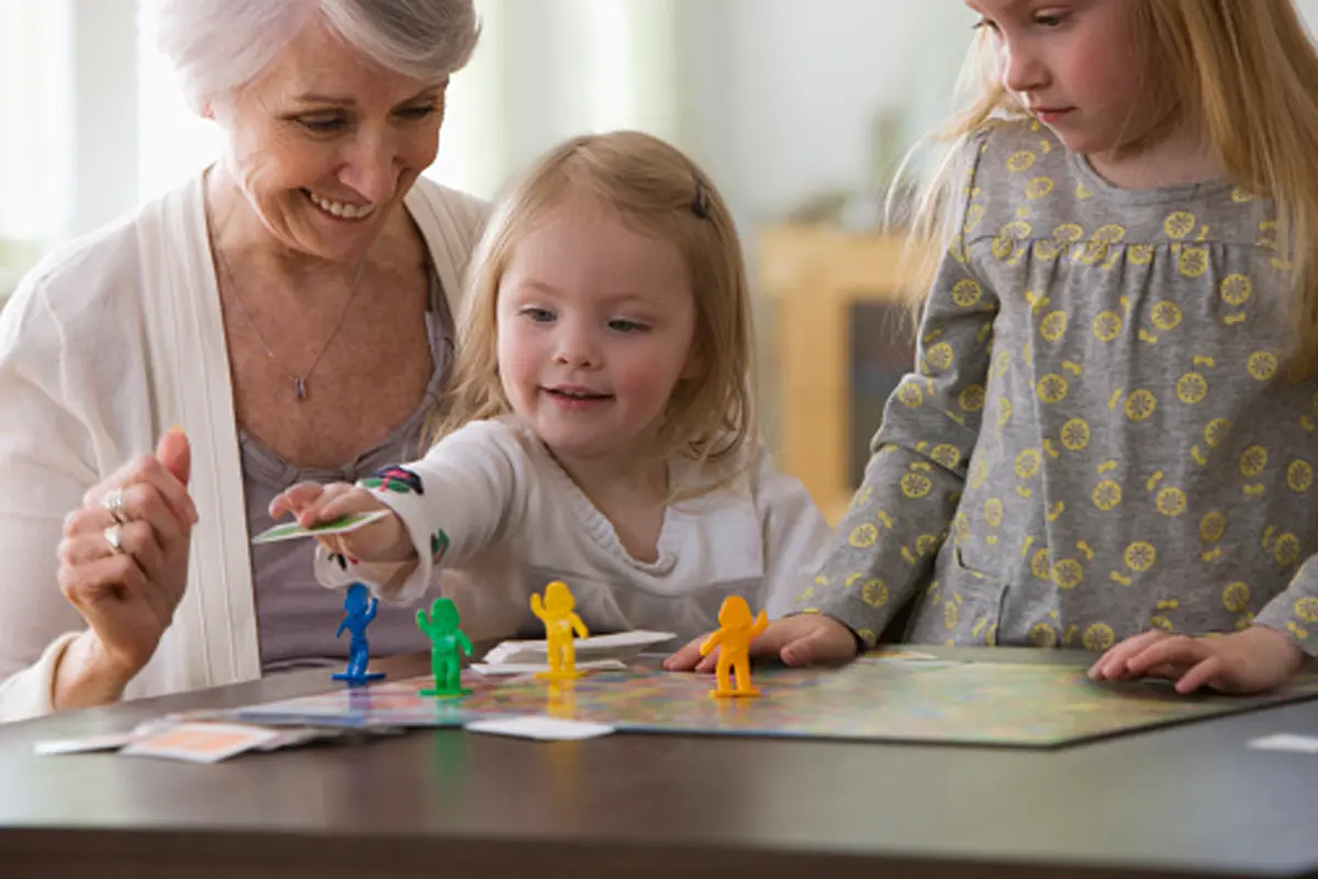 close up of hands playing a board game