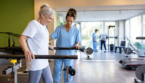 patient and medical professional doing rehabilitation exercises