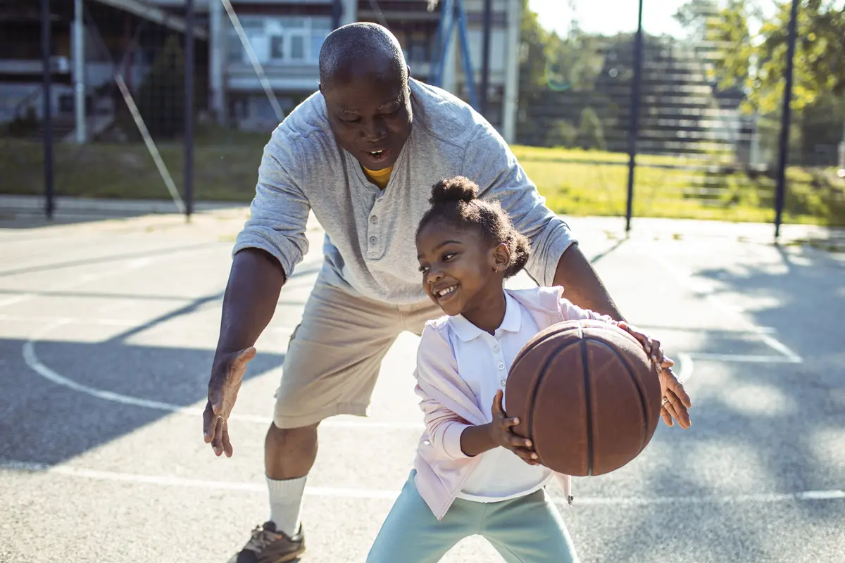 older adults playing basketball