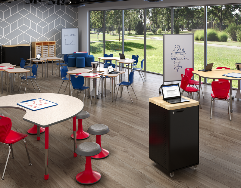 Yellow and orange modern learning environment with pod seating, counter seating, a padded circular bench, and several white boards.