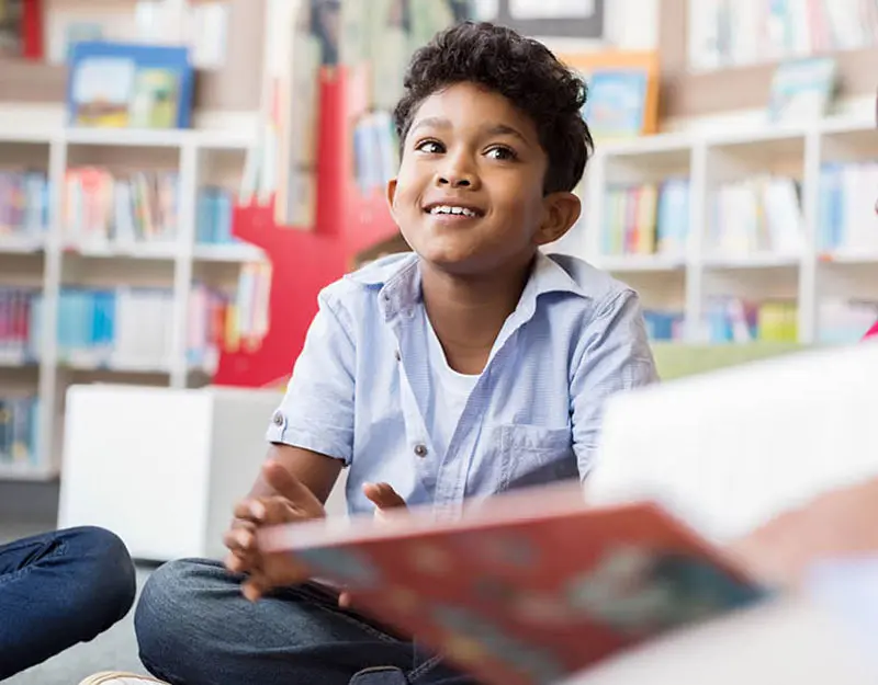 little boy with a book